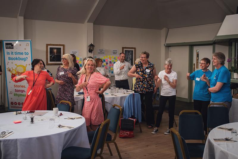 Shared Practice event in Inveraray showing Bookbug practitioners dancing to a song or rhyme